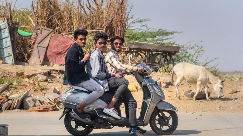 Gujarat HC: Tripling on Bike Not Negligence, Boosts Compensation to ₹14.9 Lakh