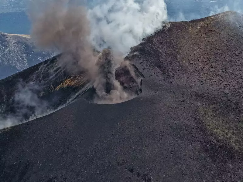 Mount Etna Erupts: Ash Clouds & Sporadic Explosions Grip Sicily