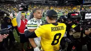 Rodgers & Love's Heartwarming Sideline Moment Goes Viral After Packers Triumph Over Steelers