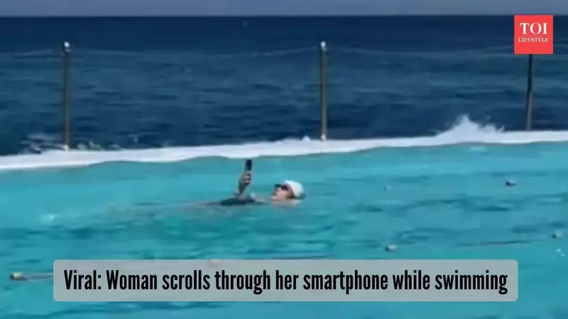 Woman Scrolls Phone While Swimming: A Stark Look at Digital Addiction