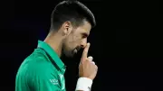 Novak Djokovic Advances to Australian Open Quarter-Finals After Jakub Mensik Withdrawal