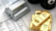 Silver and Gold Futures See Sharp Decline as Traders Cash in on Record Highs