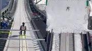 Ski Jumpers Soar Through Snowy Peaks in Breathtaking Display of Skill