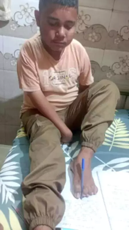 Ahmedabad Teen with Disability Writes Class 10 Exams Using His Feet, Inspires Many
