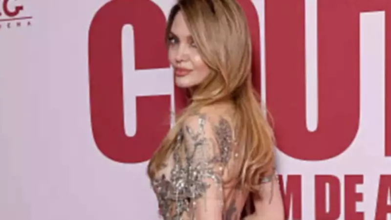 Angelina Jolie Stuns at Paris 'Couture' Premiere in Sheer Silver Gown