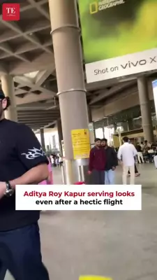 Aditya Roy Kapur Returns to Mumbai, Charms Paparazzi with Signature Smile