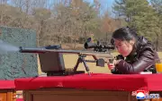 North Korea's Kim Jong Un's Daughter Ju Ae Fires Rifle in State Media Photo