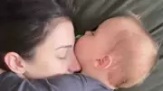 Viral Video of Sleeping Baby's Hug Sparks Emotional Motherhood Conversation