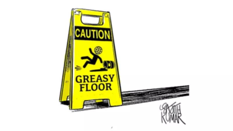 DH Cartoon Satirizes Political Slippery Slope with 'Caution: Greasy Floor'