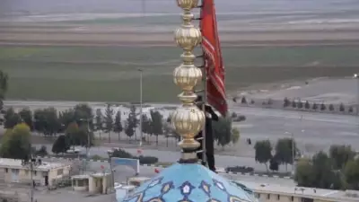 Iran Unfurls Red Flag Over Iconic Mosque: Symbolism and Global Implications