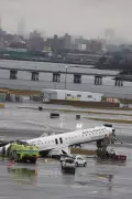 Air Canada Express Jet Collides with Fire Truck at New York Airport, Two Pilots Dead