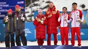 German Paralympians Turn Backs on Russian Flag in Silent Protest at Winter Games