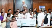 Telangana CM Revanth Reddy Presents Rs 1 Crore Insurance to Bereaved Families