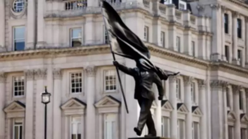 Banksy Unveils Statue of Flag-Wielding Man Poised to Step Off Plinth in London