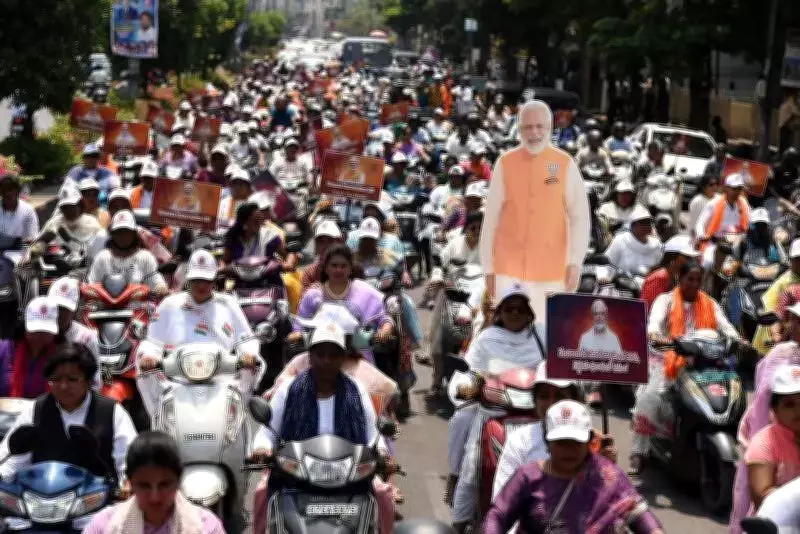 BJP Yuva Morcha Holds Scooty Rally in Hyderabad Supporting Women's Reservation Bill