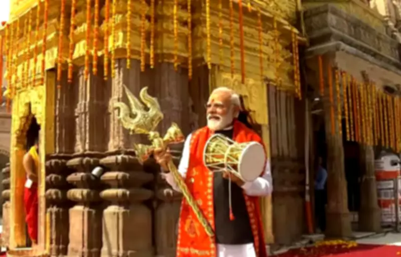 Modi holds trishul and damru at Kashi Vishwanath Temple before Bengal polls