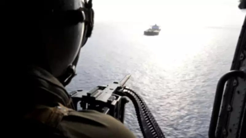 US Navy Helicopter Confronts Ship in Strait of Hormuz Amid Regional Tensions