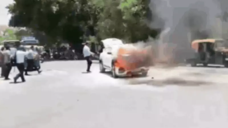 Car Engulfed in Flames on Delhi Road Amid Intense Heat, Panic Ensues