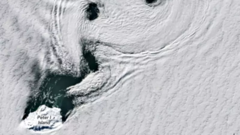 NASA Captures Stunning Spinning Clouds Over Antarctica's Peter I Island