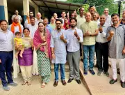 Dhumal, Anurag Thakur Cast Votes at Sameerpur Polling Station