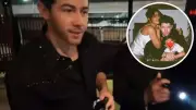 Nick Jonas Melts Hearts With Family Phone Wallpaper Featuring Priyanka and Daughter
