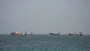 Cargo Ship Reports Attack in Strait of Hormuz Amid Iran War