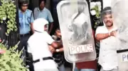 Kolkata police use riot shields to protect Trinamool councillor from egg protest